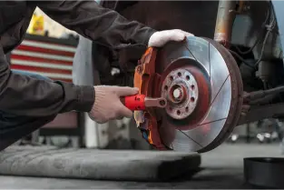 Guerrero Mobile Mechanics™: Best Mobile Auto Repair in Killeen, TX 2 Car brake service technician repairing the brake system with tools for optimal performance