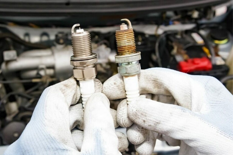 A Mechanic Showing Two Engine Wires Causing Rough Idling