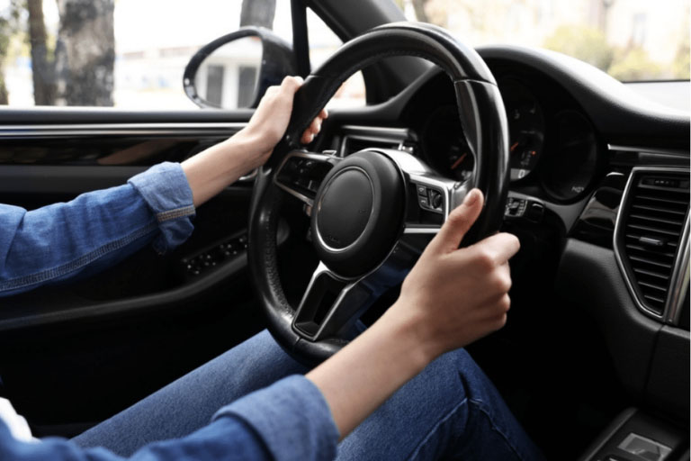 A Person Holding a Vibrating Steering Wheel