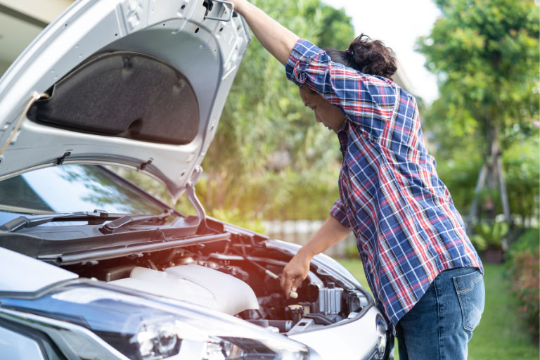 A Women Checking the Engine Noise