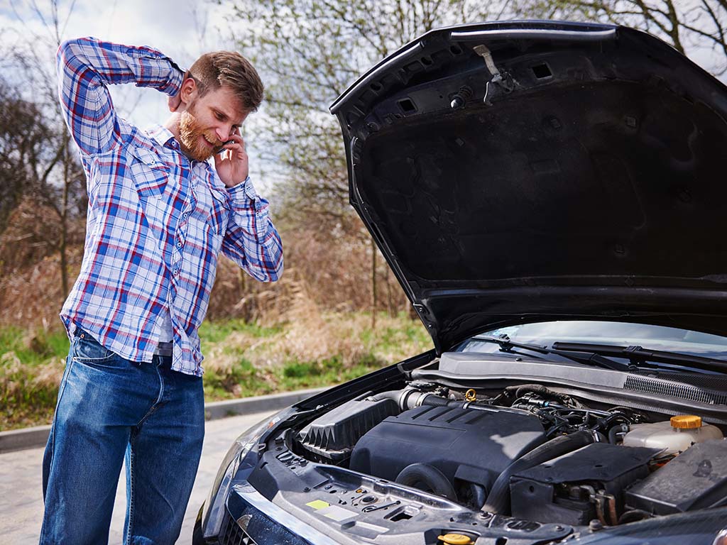 Top Causes of Low Oil Pressure in Car Engines 3 Man having problem with his car
