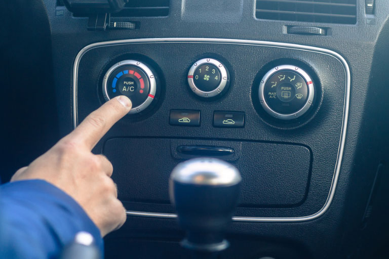 A Man Inspecting the Car’s Heating System
