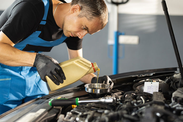 Guerrero Mobile Mechanics™: Best Mobile Auto Repair in Killeen, TX 1 A Mechanic Performing an Oil Change on a 3.6L Pentastar Engine