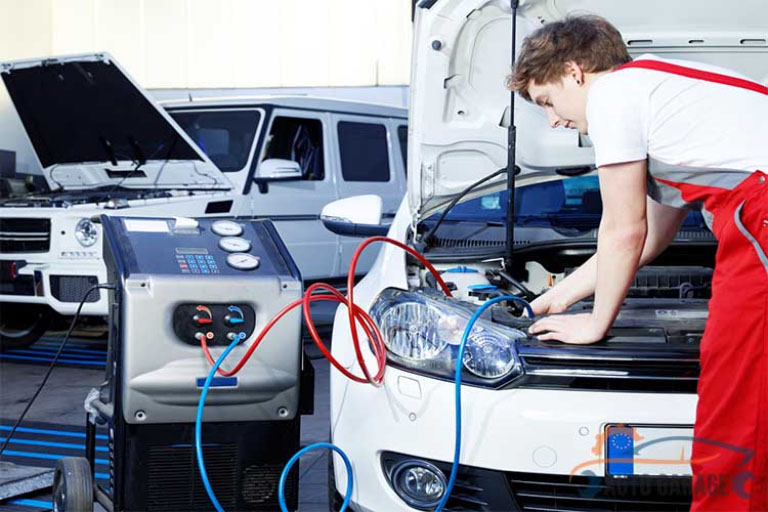 Guerrero Mobile Mechanics™: Best Mobile Auto Repair in Killeen, TX 3 A Mechanic Repairing Car_s AC System with Tools in Garage