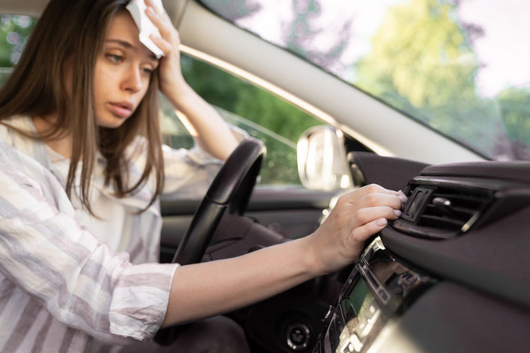 Guerrero Mobile Mechanics™: Best Mobile Auto Repair in Killeen, TX 5 A Woman Sweating in Car, Adjusting AC Vent
