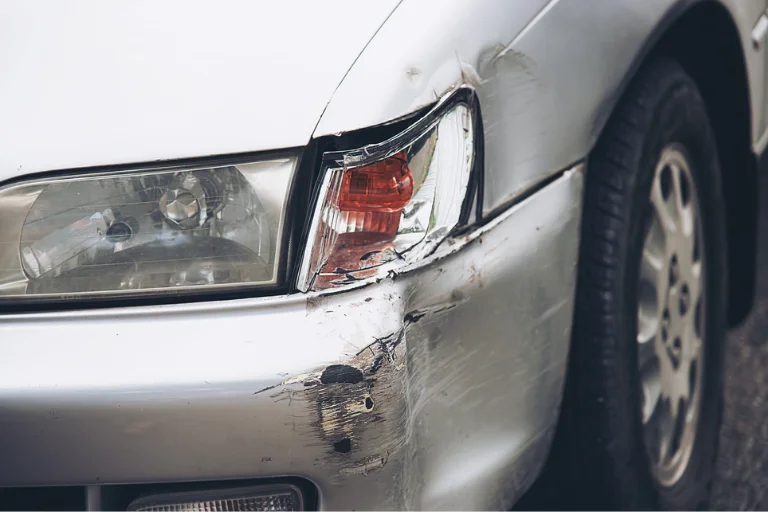 A Close-Up Shot of a Car Panel with Scratches