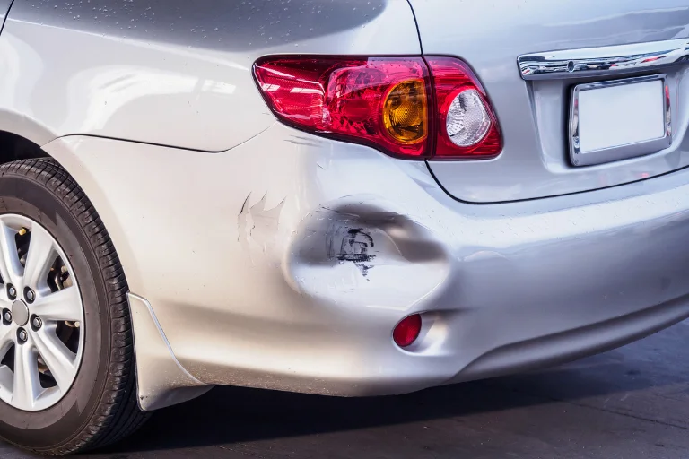 Paintless Dent Repair (PDR): What It Is & When You Should Use It 3 A Close-Up of Medium-Sized Dents on a Car