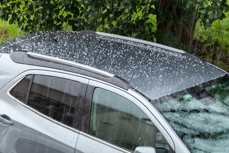 Paintless Dent Repair (PDR): What It Is & When You Should Use It 4 Hail damage on a Car Roof