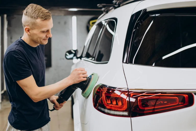 Paintless Dent Repair (PDR): What It Is & When You Should Use It 2 Technician Performing Paintless Dent Repair on a Car