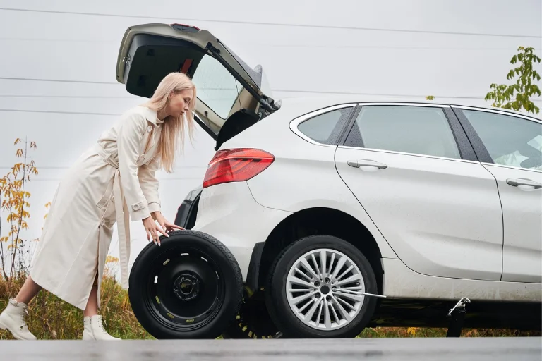 A Car with a Bent or Cracked Rim on the Road