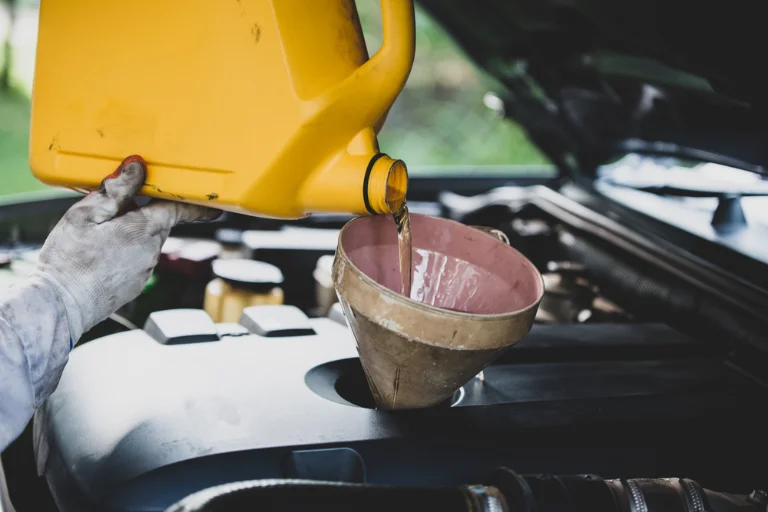 Mobile Oil Change vs Traditional Oil Change: Which Is Better? 4 A Mechanic Changing the Oil of a Car