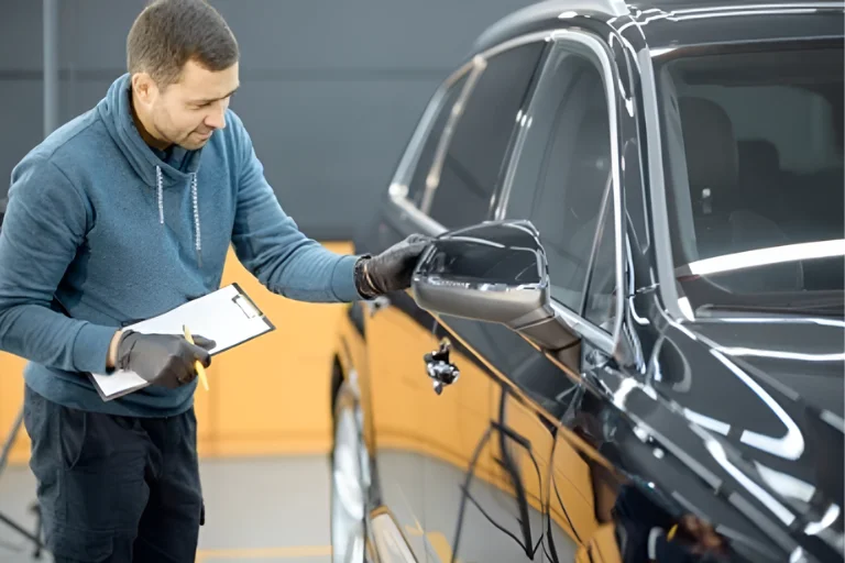 Dent vs Scratch: What Needs Immediate Repair and What Can Wait 4 A Technician Inspecting Car Body for Dents and Scratches