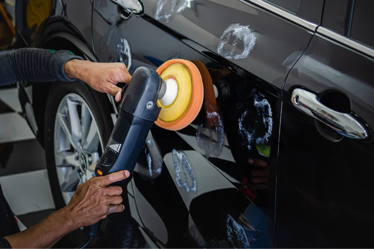 Close-up of Technician Assessing a Scratch With Tools