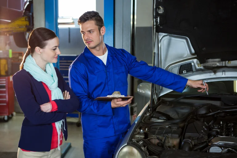 The Convenience of Mobile Oil Change in Dallas: Get Your Oil Changed at Your Doorstep 3 Mechanic Explaining Mobile Oil Change Service to the Car Owner