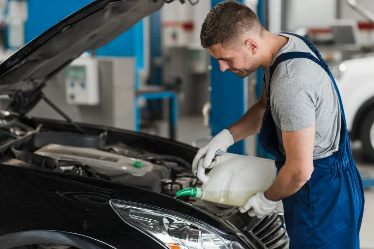 The Convenience of Mobile Oil Change in Dallas: Get Your Oil Changed at Your Doorstep 2 Mechanic Performing Mobile Oil Change Service in a Car