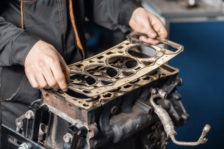 Close-Up of an Engine Head Gasket Repair with Visible Engine Components