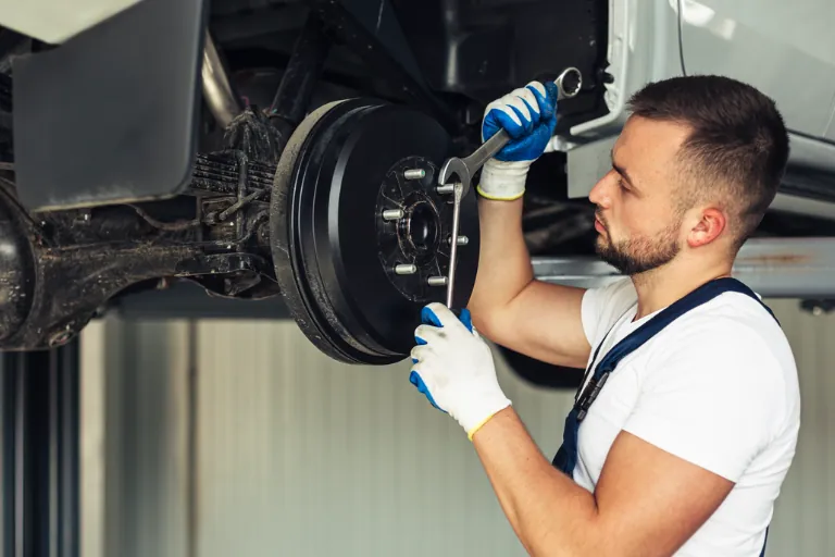 Mobile Brake Repair New York: Safe Stops in NYC 2 A Brake Service NYC Technician Replacing Brake Pads on a Vehicle