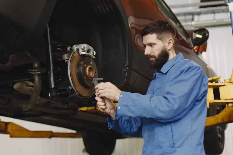 A Mobile Mechanic Performing Brake System Repair