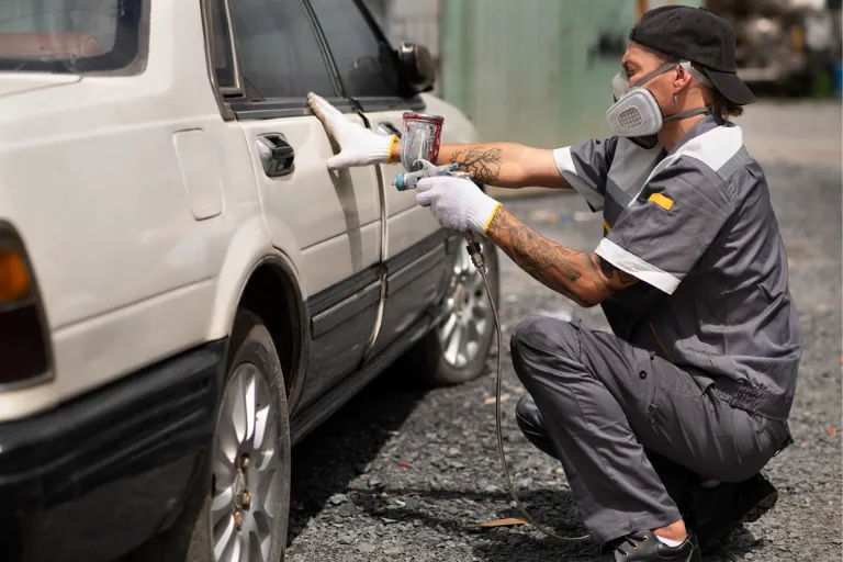 Scratches, Dents & Bodywork: Can a Mobile Mechanic Fix These in the USA? 2 A Mobile Mechanic Performing Minor Dent Repair on a Car
