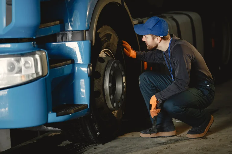 Mobile Mechanic Fleet Service USA — Multi-Vehicle Repair Plans 3 A Mechanic Performing a Brake Inspection on a Work Truck