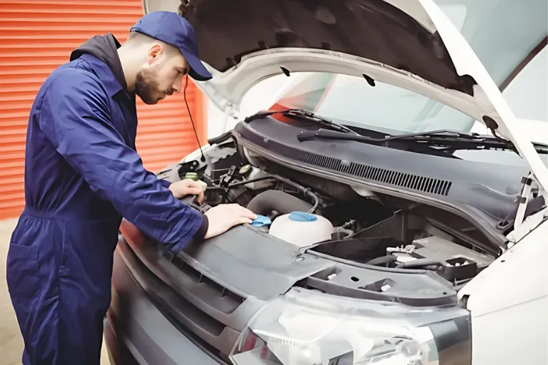 A Mechanic Is Inspecting the Broken-Down Van