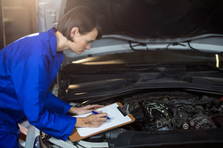 A Technician Reviewing Fleet Vehicle Maintenance Checklist