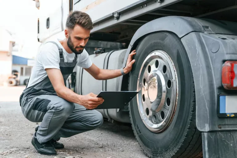 A Technician is Inspecting a Commercial Work Truck