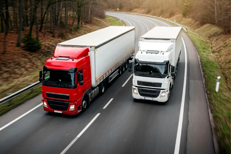 Commercial Trucks Driving on a Highway