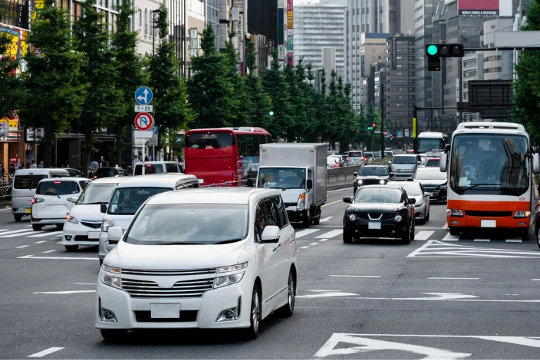 Commercial Vehicles Driving Through Heavy City Traffic