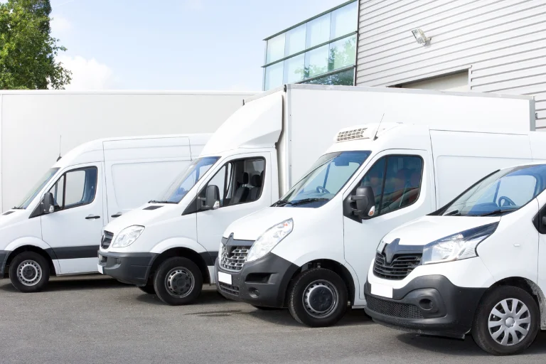Amazon delivery van fleets parked at a warehouse