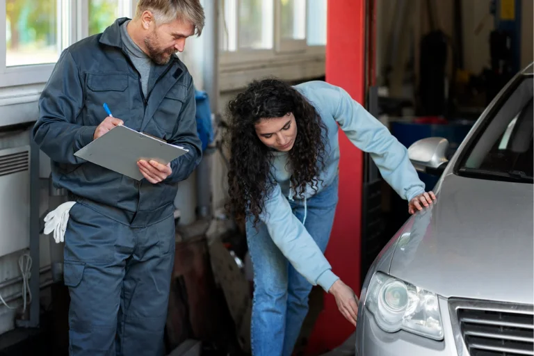 Technician inspecting a rental vehicle before the next customer