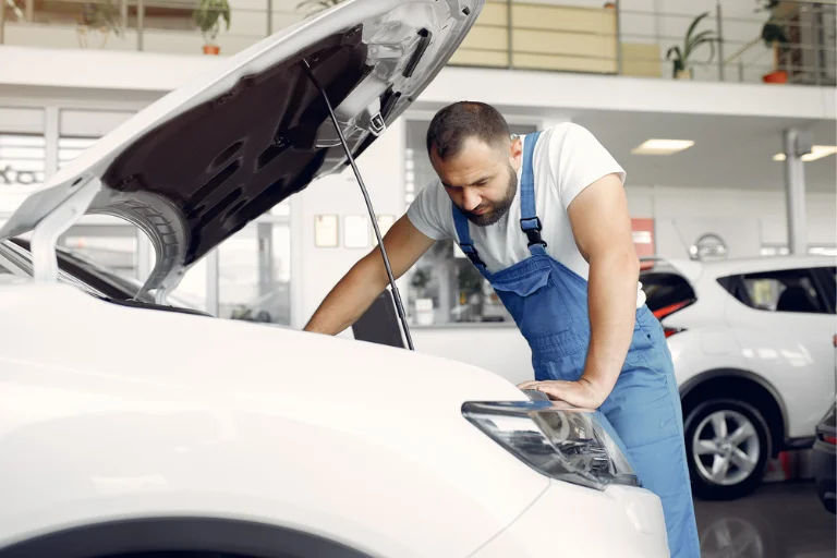 Technician performing mobile fleet repair on rental vehicles in Houston