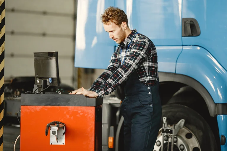 Diesel Fleet Maintenance Houston TX: Keep Trucks Running 2 A Diesel mechanic inspecting a commercial truck