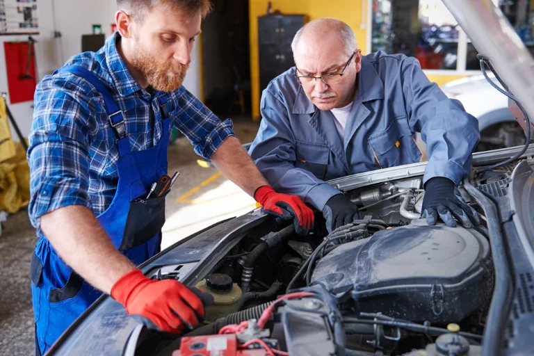 Starter motor beside a repair estimate or mechanic replacing it